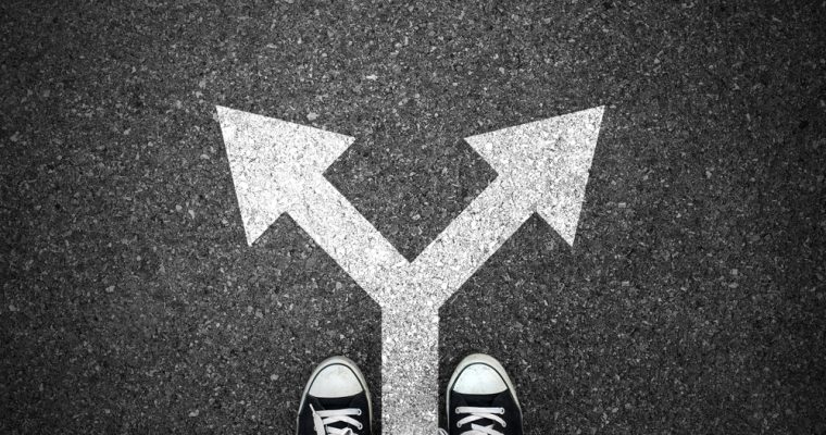 fork sign in road with shoes