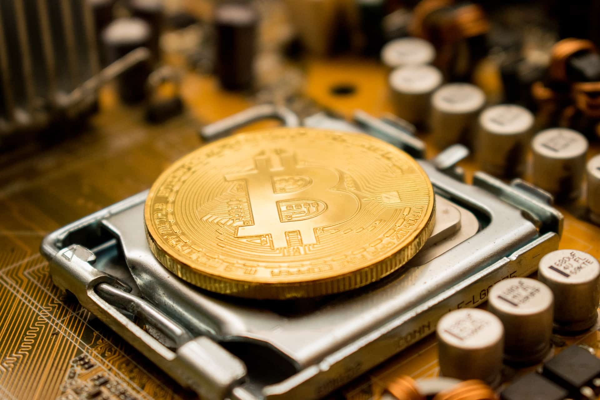 Physical Bitcoin placed on top of a computer processor