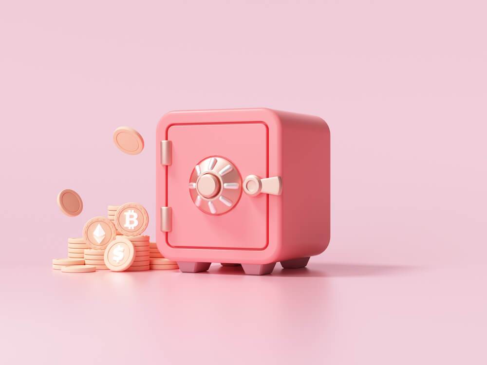 Pink crypto vault with coins on a dusty pink background to illustrate a secure crypto wallet.