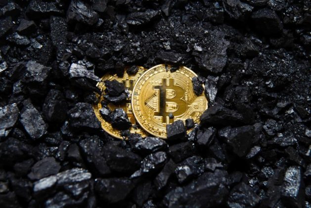 Bitcoin-gold-coin-crypto-currency-virtual-currency-background-coal-mining bitcoin NZ New Zealand coin in pile of coal