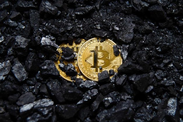 Bitcoin-gold-coin-crypto-currency-virtual-currency-background-coal-mining bitcoin NZ New Zealand coin in pile of coal