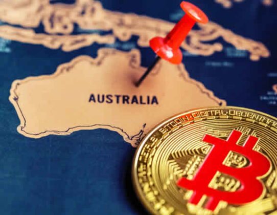 bitcoin-btc-illustration-puh-pin-australia-map Bitcoin (BTC) is illustrated as physical coin laying on a map and a push pin is nailed on Australia area