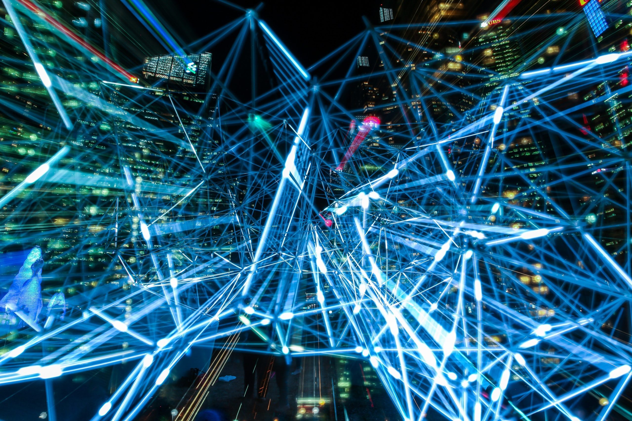 Image of a network of interconnected lights to depict the concept of decentralization.