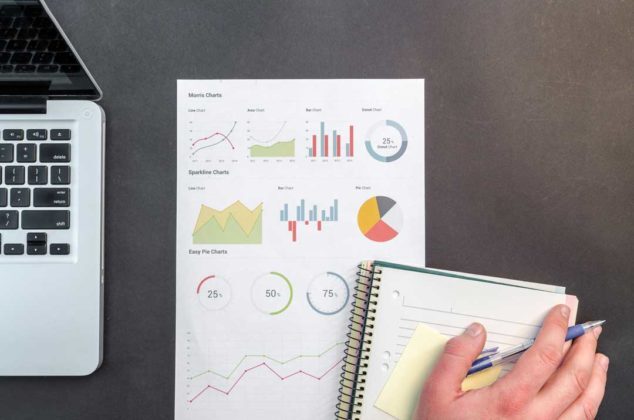 A person is taking notes on tips for starting an investment