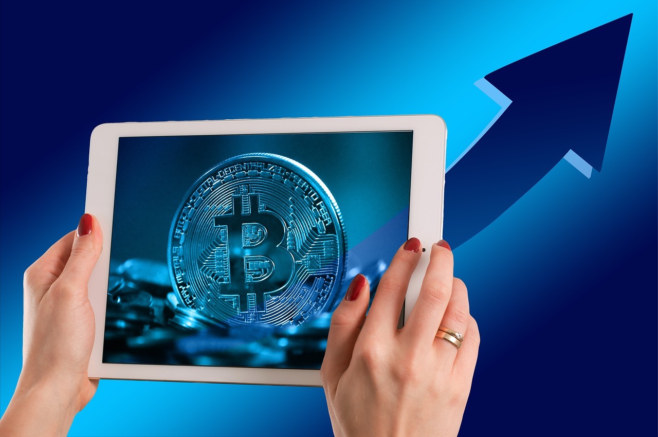 Illustration of Bitcoin rising in price displayed on an iPad.