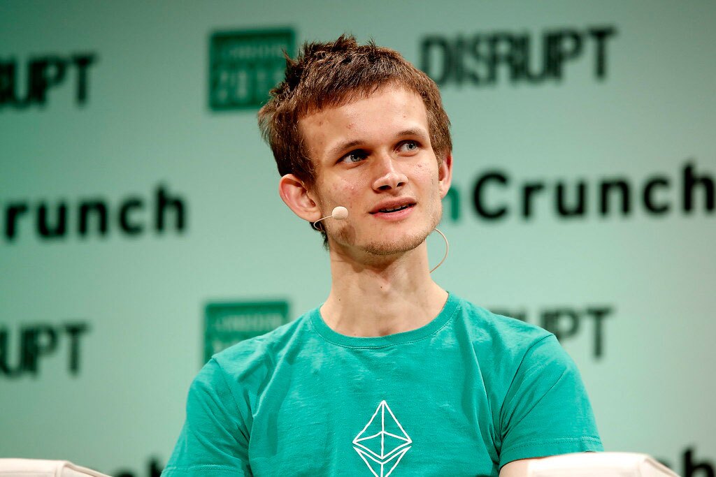 Vitalik Buterin is speaking in public a forum.