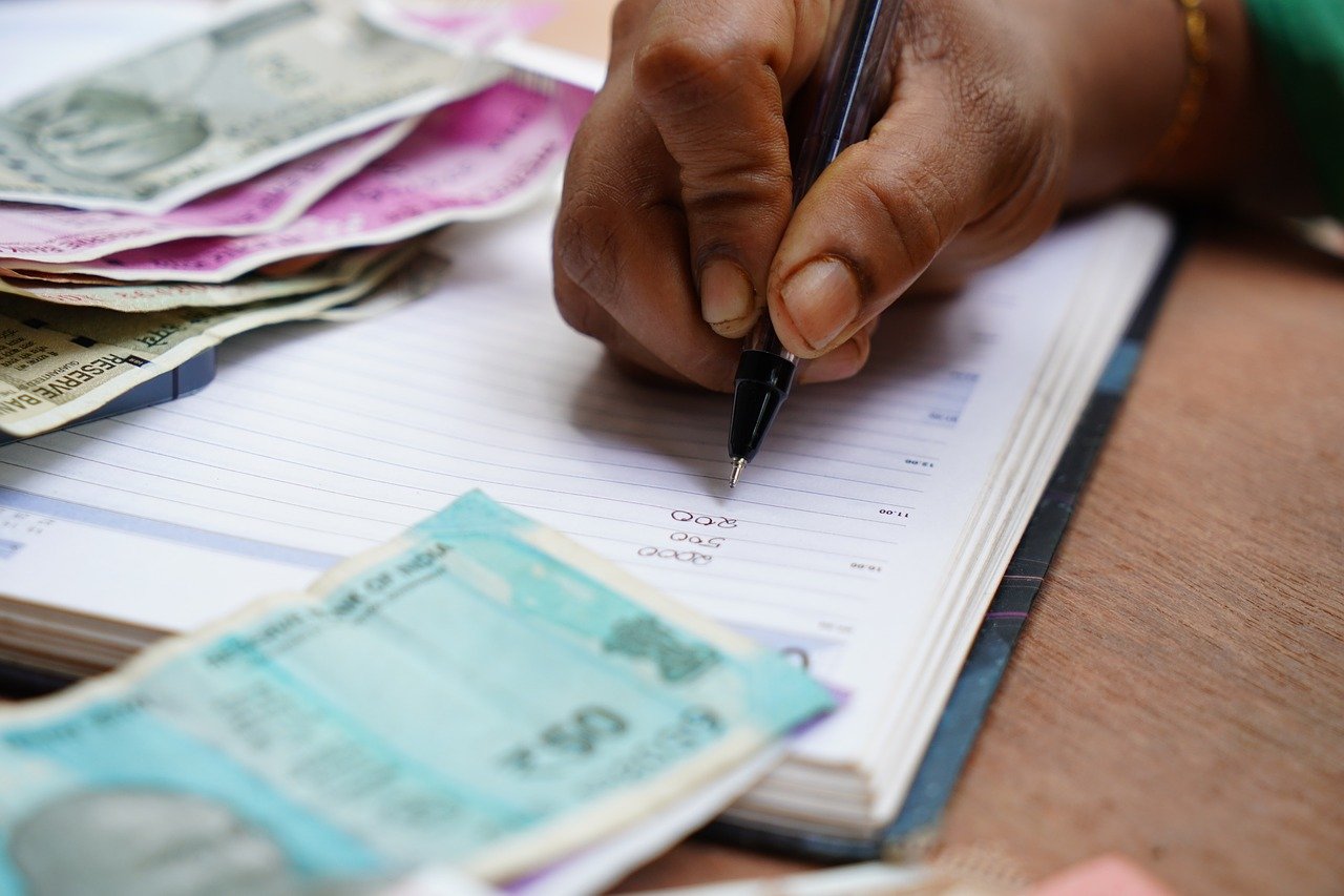 An image of a man's hand to illustrate the idea of investing in cryptocurrency