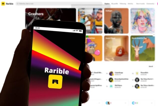 Rarible app on iphone in front of computer screen